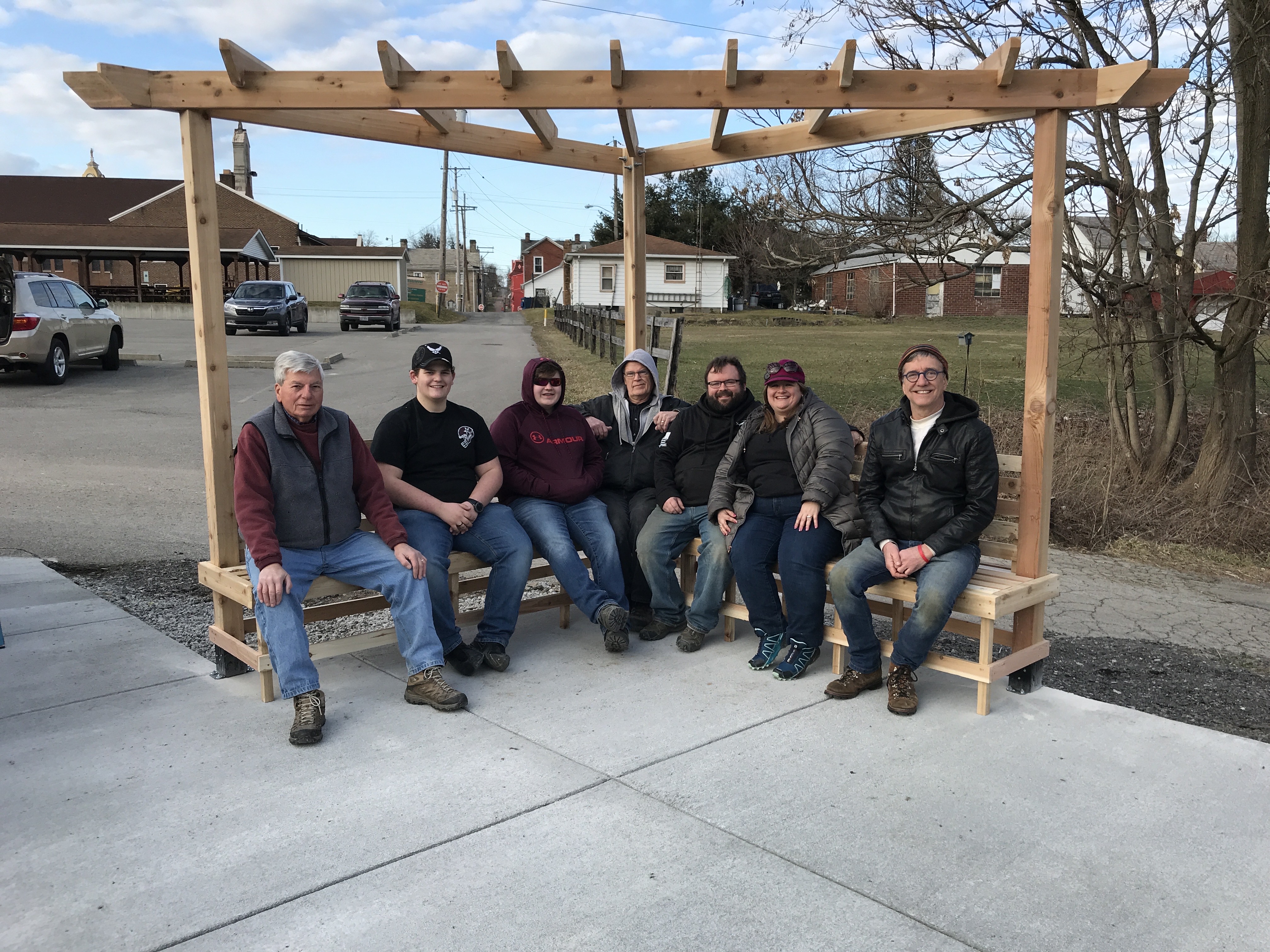 BCAAR Volunteers on a wooden bench at the site of the park